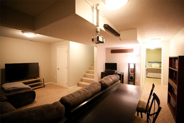 carpeted living room with a textured ceiling, stairs, and baseboards