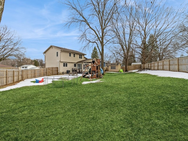 view of yard with a playground, a patio area, and a fenced backyard