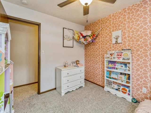 playroom featuring baseboards, ceiling fan, carpet flooring, and wallpapered walls