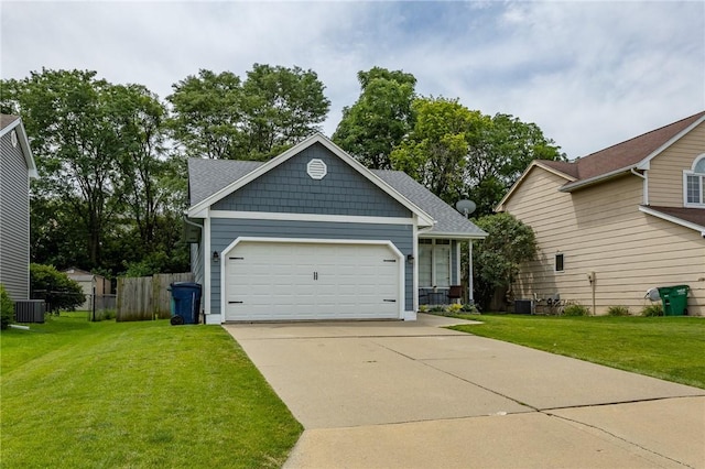 view of front facade with an attached garage, a front yard, central AC, fence, and driveway