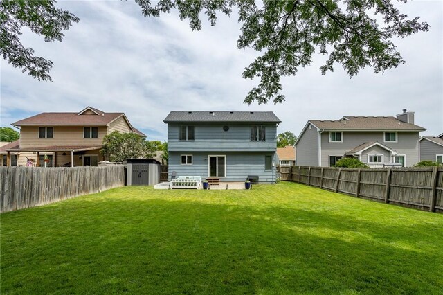 7014 Northview Dr, Urbandale, IA 50322 - rear view of house with a fenced backyard and a shed