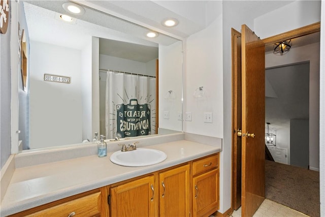 bathroom with vanity and recessed lighting