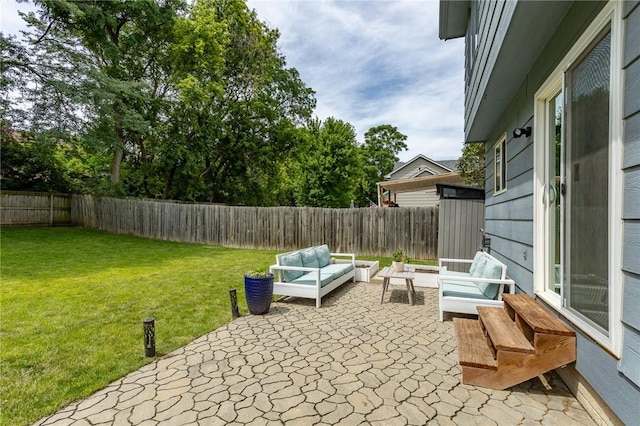 view of patio with an outdoor hangout area and a fenced backyard