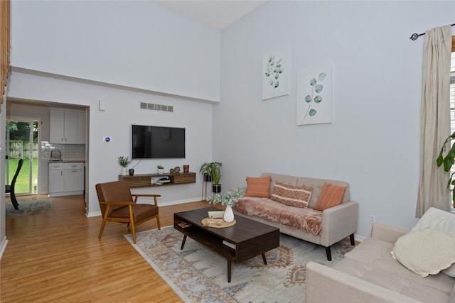7014 Northview Dr, Urbandale, IA 50322 - living room with light wood-style floors and a high ceiling