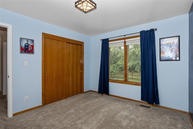 7014 Northview Dr, Urbandale, IA 50322 - unfurnished bedroom with carpet flooring and a closet