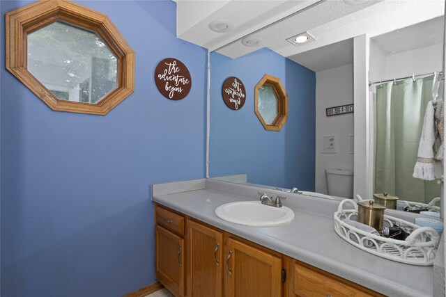 7014 Northview Dr, Urbandale, IA 50322 - bathroom featuring vanity and a shower with curtain
