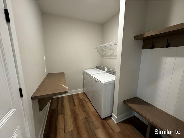 laundry area with dark wood-style floors, laundry area, independent washer and dryer, and baseboards