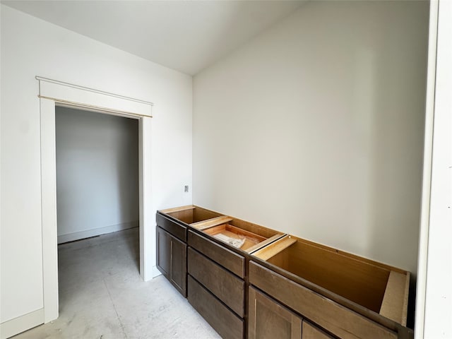 interior space with unfinished concrete flooring