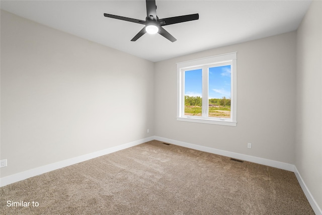 712 Academy Cir, Nevada, IA 50201 - carpeted spare room with baseboards and ceiling fan