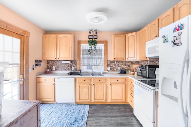 kitchen with white appliances, light brown cabinets, a sink, light countertops, and tasteful backsplash