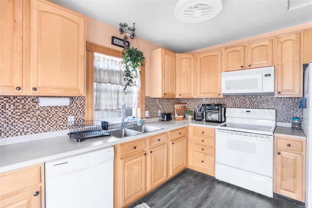 kitchen with visible vents, light brown cabinetry, a sink, white appliances, and light countertops