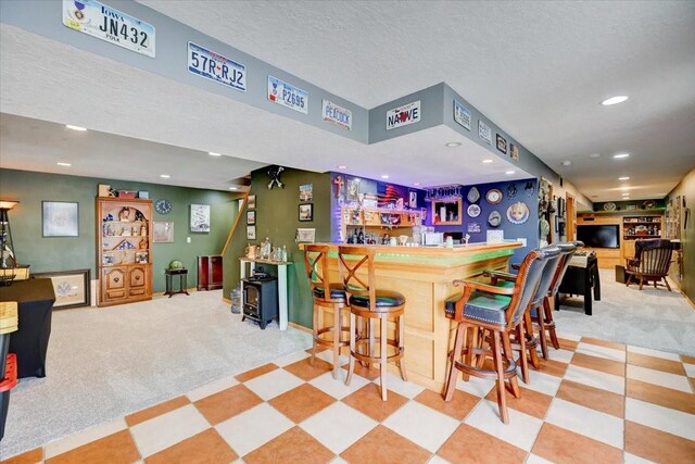 7087 Hillcrest Ct, Johnston, IA 50131 - indoor dry bar with carpet floors and recessed lighting