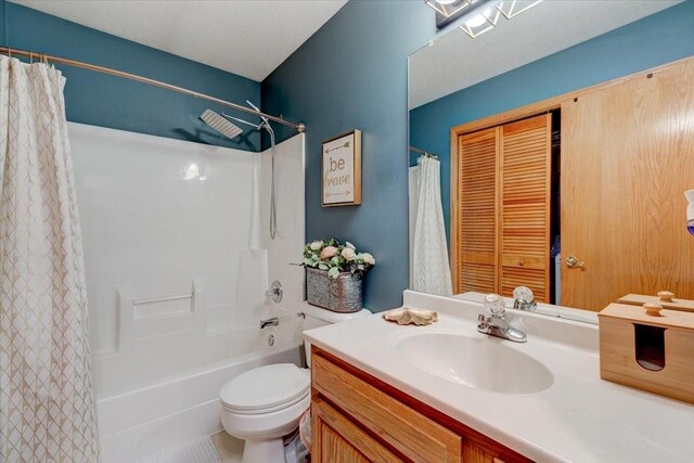 7087 Hillcrest Ct, Johnston, IA 50131 - bathroom featuring vanity, toilet, and shower / bathtub combination with curtain