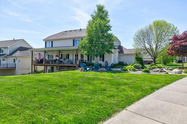 7087 Hillcrest Ct, Johnston, IA 50131 - view of front of home with a front lawn and a ceiling fan