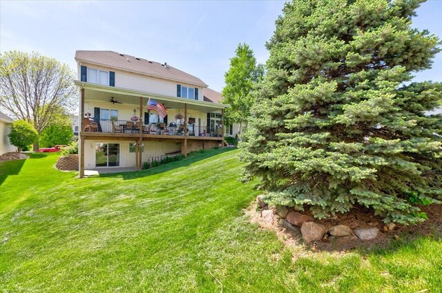 7087 Hillcrest Ct, Johnston, IA 50131 - back of property with ceiling fan and a lawn