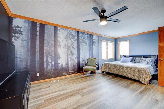 7087 Hillcrest Ct, Johnston, IA 50131 - bedroom with ornamental molding, light wood finished floors, a textured ceiling, baseboards, and ceiling fan