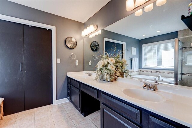 7087 Hillcrest Ct, Johnston, IA 50131 - full bathroom with tile patterned floors, double vanity, a garden tub, and a shower with shower door
