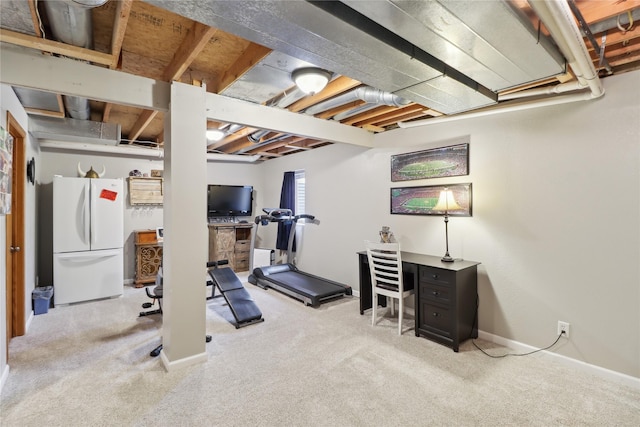 workout area with carpet flooring and baseboards