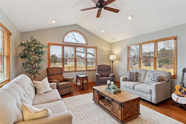 living room featuring vaulted ceiling, ceiling fan, wood finished floors, and recessed lighting