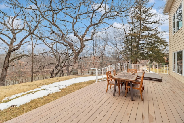 deck with outdoor dining area