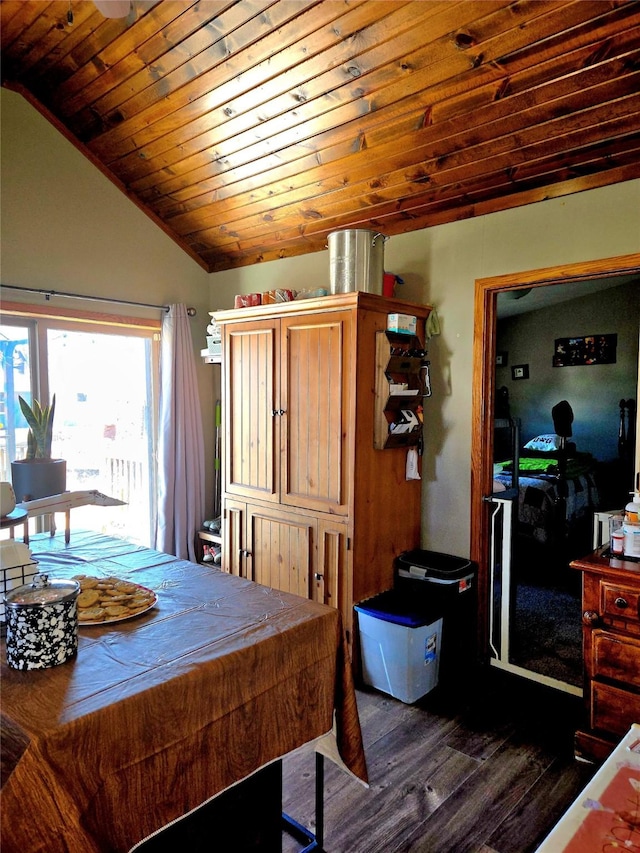 dining room featuring wooden ceiling, lofted ceiling, and dark wood-style flooring