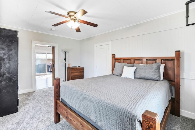 bedroom with baseboards, carpet, a ceiling fan, and crown molding