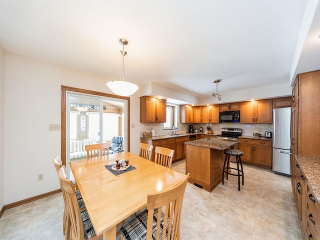 dining space with baseboards