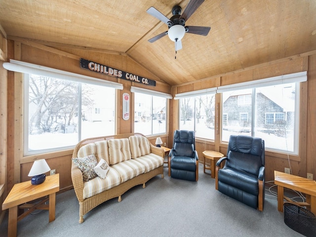 sunroom / solarium with lofted ceiling, wooden ceiling, and a ceiling fan