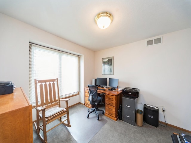 carpeted home office featuring baseboards and visible vents