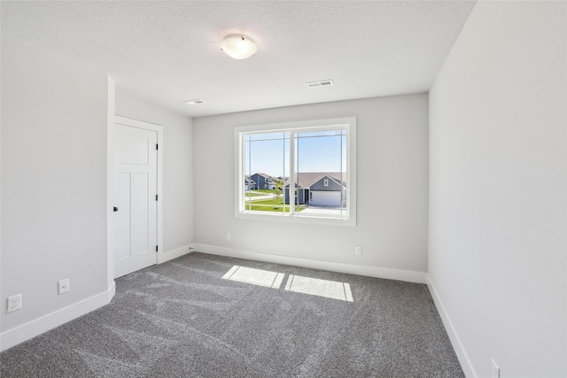 2208 White Oak Ln, Granger, IA 50109 - carpeted empty room with baseboards and a textured ceiling