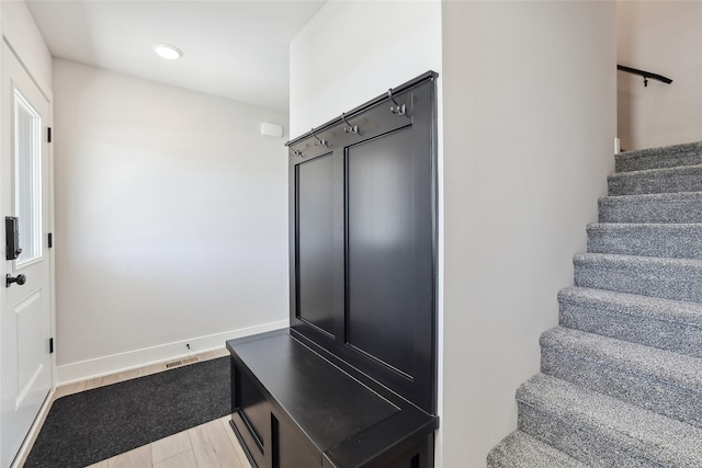 2208 White Oak Ln, Granger, IA 50109 - stairs featuring recessed lighting and baseboards