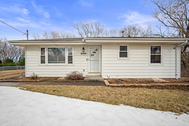 view of front of home featuring fence