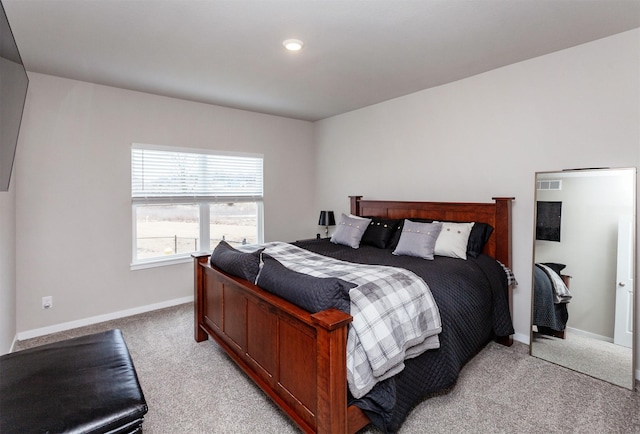 bedroom featuring light carpet, visible vents, and baseboards