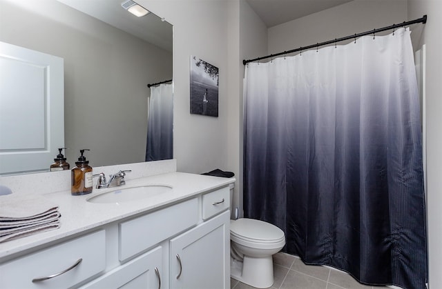 full bath featuring tile patterned flooring, toilet, and vanity