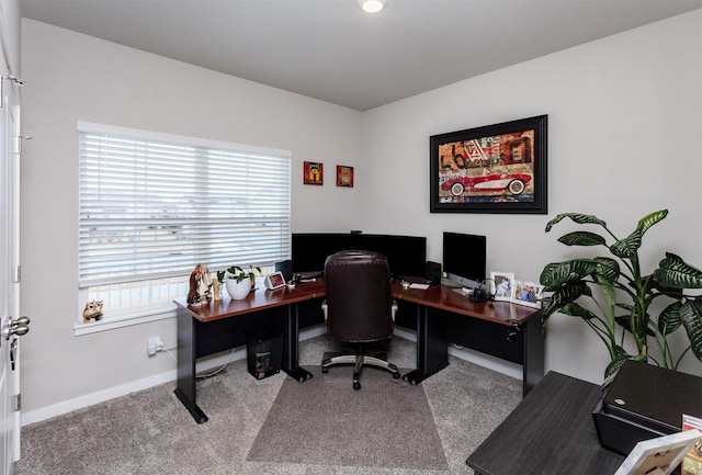 carpeted office space featuring baseboards