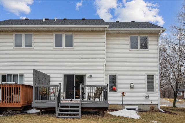 rear view of property featuring a wooden deck and roof with shingles