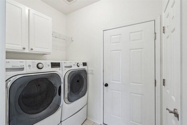 laundry room with cabinet space and independent washer and dryer