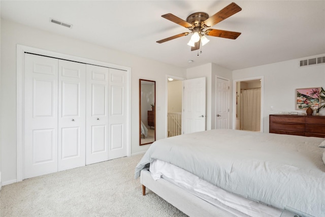 bedroom with visible vents, carpet, a closet, and ceiling fan