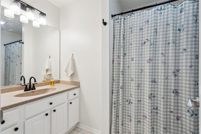 full bathroom featuring tile patterned flooring, vanity, and a shower with curtain