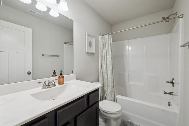 3325 Wolf Creek Rd SW, Bondurant, IA 50035 - bathroom featuring toilet, vanity, shower / tub combo with curtain, and visible vents