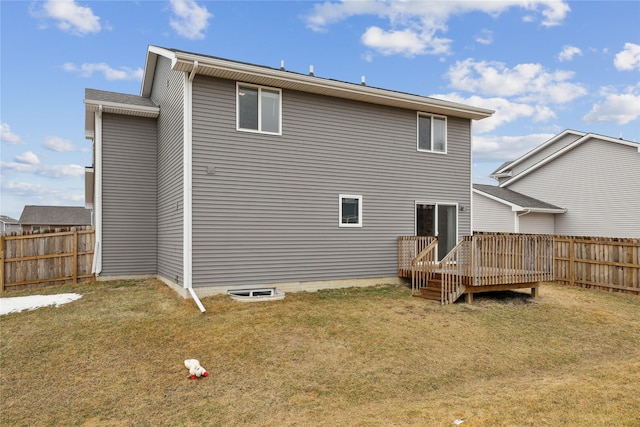 3325 Wolf Creek Rd SW, Bondurant, IA 50035 - rear view of property with fence, a deck, and a lawn