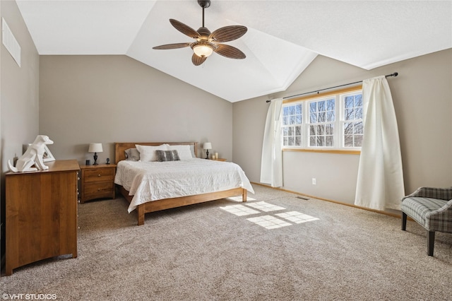 bedroom with a ceiling fan, visible vents, carpet floors, baseboards, and vaulted ceiling