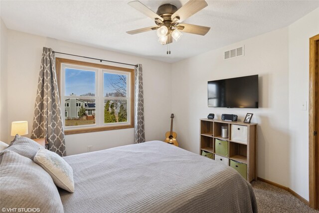 bedroom featuring visible vents, carpet flooring, baseboards, and ceiling fan