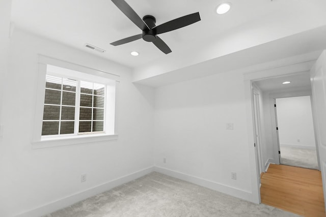 unfurnished room with visible vents, baseboards, ceiling fan, light carpet, and recessed lighting