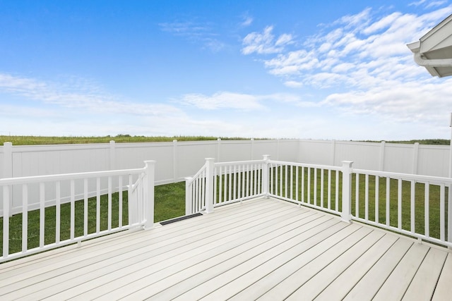 wooden deck with a yard and fence