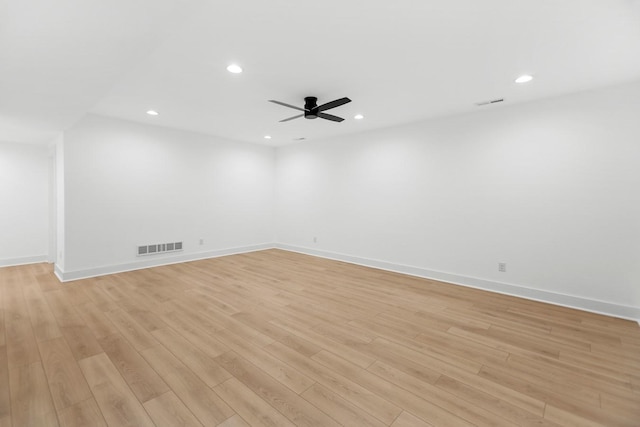 spare room featuring recessed lighting, visible vents, and light wood-style floors