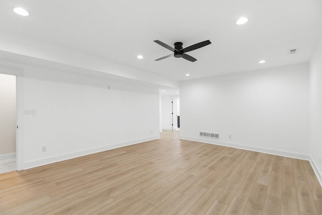 empty room featuring a ceiling fan, recessed lighting, visible vents, and light wood finished floors