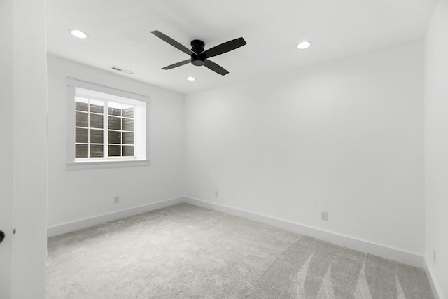 unfurnished room featuring visible vents, carpet, and baseboards