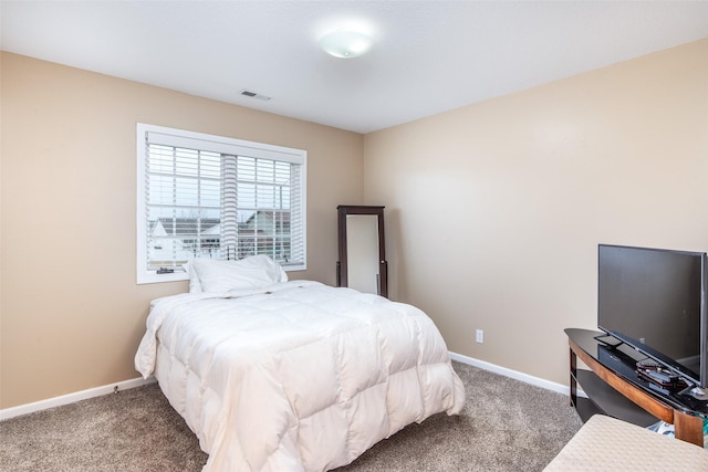 bedroom featuring carpet, visible vents, and baseboards