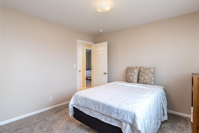 carpeted bedroom with baseboards